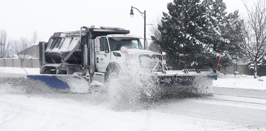 A Herriman City snow plow clears a road during a snowstorm in 2020