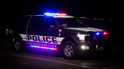 Herriman Police truck flashes its lights at night