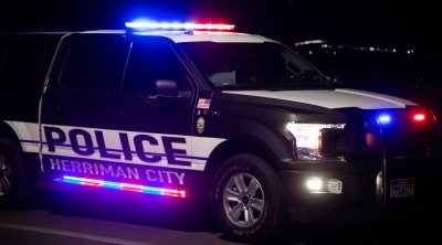 Herriman Police truck flashes its lights at night