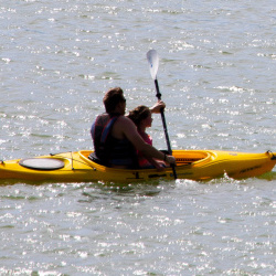 Two kayakers paddle across Blackridge Reservoir in Herriman