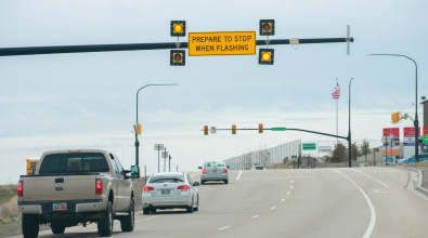 An advance warning signal flashes at a stoplight on Mountain View Corridor